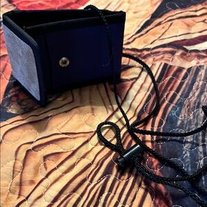 Stylish Black and Gray unisex. Bag with cord and mirror.  Great for traveling.